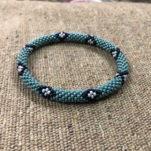 handmade turquoise teal beaded bracelet with white floral pattern seed bead bangle